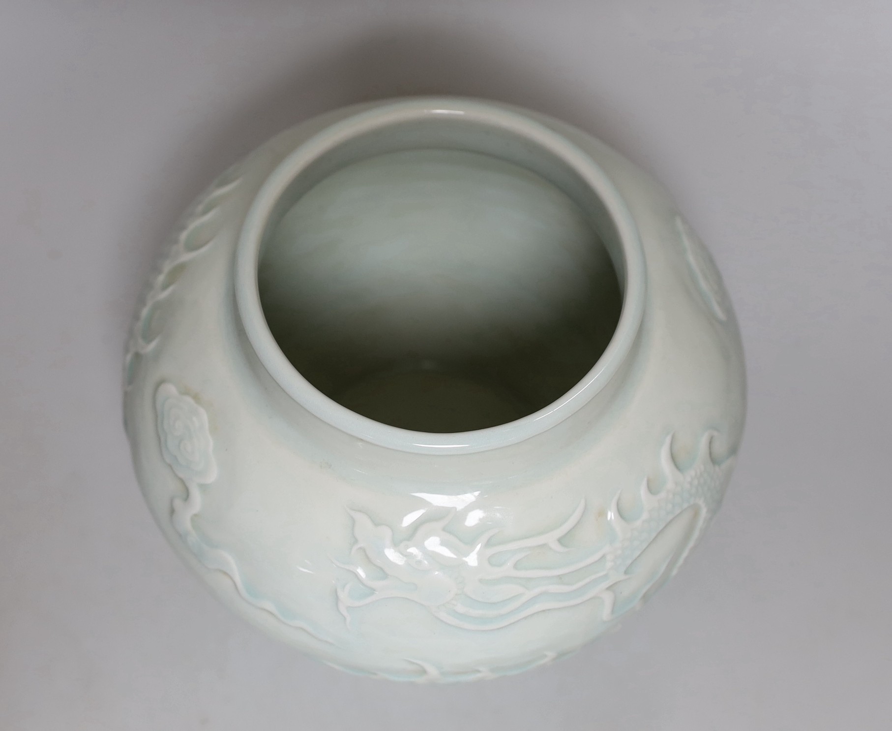A Chinese relief moulded ‘dragon’ vase, 17cms